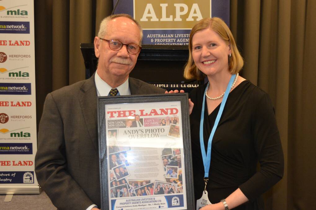 Retiring ALPA CEO Andy Madigan with his "mock up" The Land cover presented by Karen Bailey, Bathurst, during the ALPA annual general meeting in Canberra.