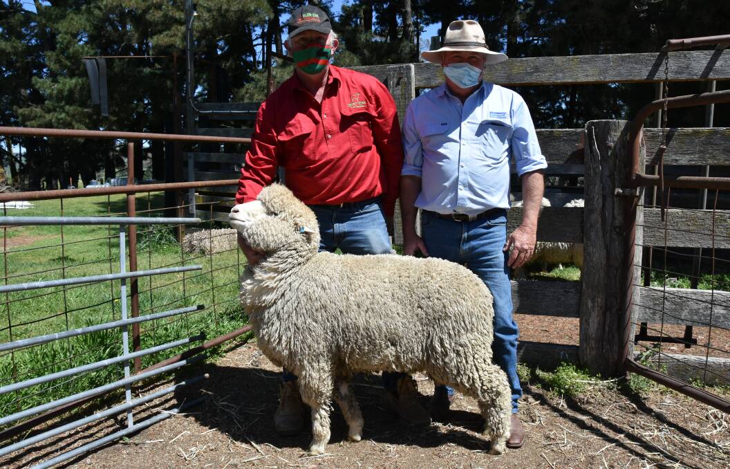 Glen Esk Corriedales principal Rick Hoolihan, Rydal, with Brett Douglas of Schute Bell Badgery Lumby, Canowindra, and one of the rams that sold for $1500.