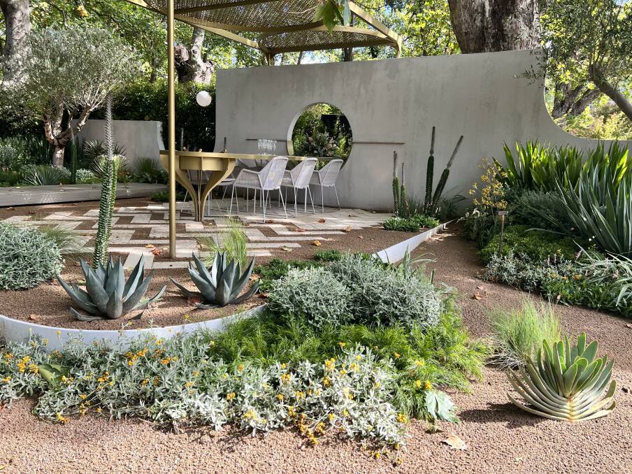 Fusion of native, Mediterranean and arid styles using exclusively drought tolerant plants. Prizewinning outdoor room Aurum at Melbourne Garden Show (MIFGS) 2023 by Mint Pool and Landscape Design (www.mintdesign.net.au).