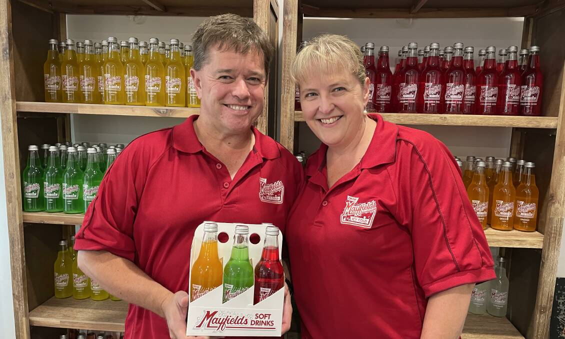 Peter Golland and his wife, Leanne Peters, with a range of old-style flavoured soft drinks they sell in Orange. Pictures by Karen Bailey.