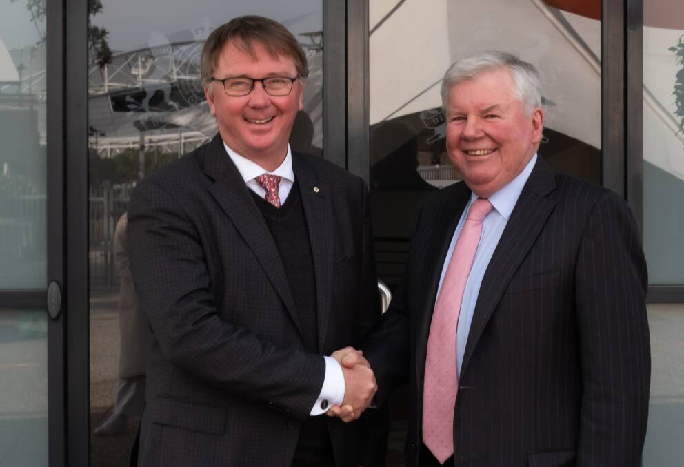 Royal Agricultural Society of NSW new president John Bennett, Worrigee, is congratulated by outgoing president Michael Millner, Millthorpe, earlier this year. Picture supplied by Royal Agricultural Society of NSW.