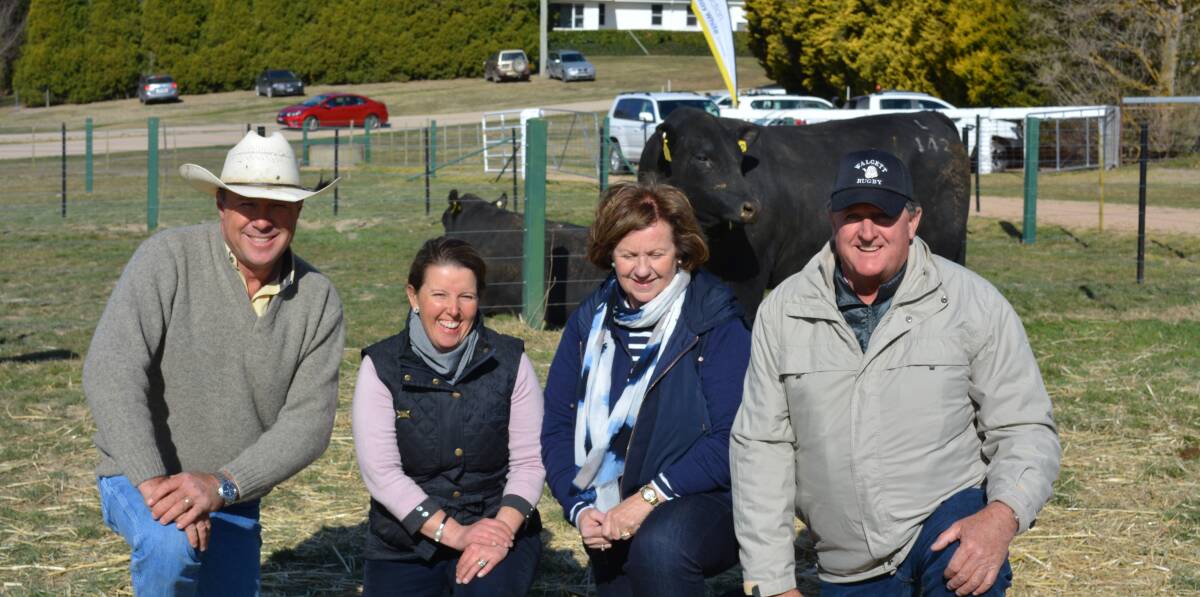 Ray White Emms Mooney auctioneer Ben Emms with Annie Scott, Karoo Angus, Bathurst, and buyers of the top priced bull ($21,000) Sue and Mark Evans, “Martindale”, Walgett, at the on-property Karoo bull sale on Friday.