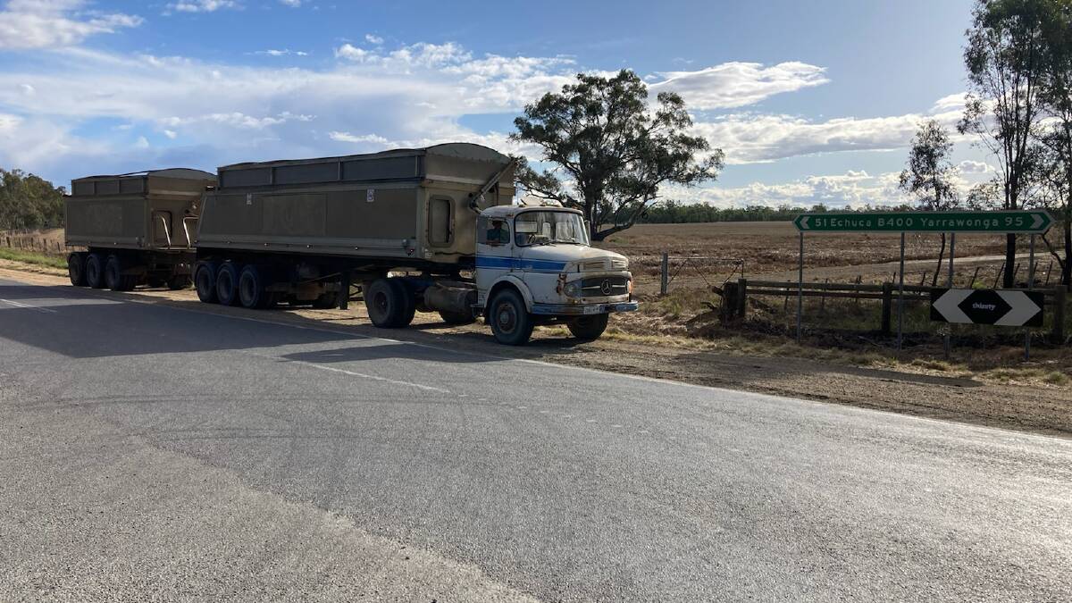 Kaarimba farmer Col Grinter in his 1418 Mercedes Benz prime mover on the Murray Valley Highway south of Nathalia.