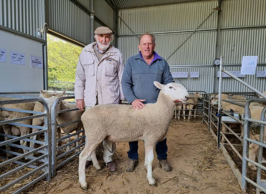 Winston McDonald, Royalla, Wallendbeen, with Geoff Selmes, Jerradale stud, Crookwell, and the $5000 top priced ram. Photo: supplied