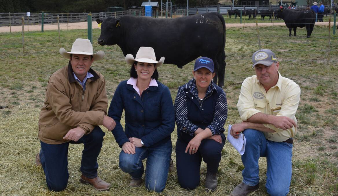 Buyers of the $15,000 top priced bull, Justin and Kate Boshammer, JK Cattle Company, Condamine, Qld, with Annie Scott, Karoo, Meadow Flat, and auctioneer Ben Emms. 