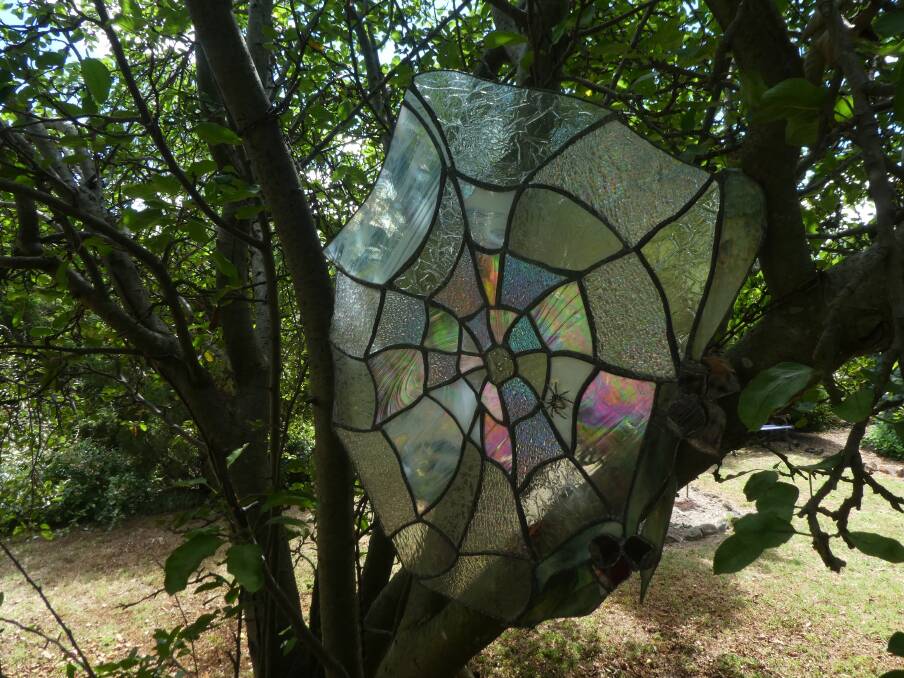 Lorraine Inwood creates unusual garden art like this imaginative leadlight cobweb (spot the spider).