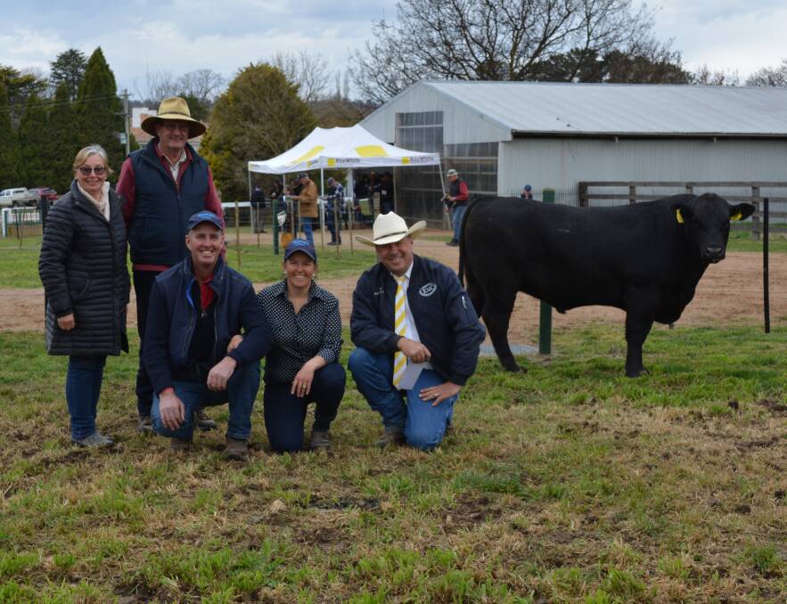 Ruth and Ross Friedrich, Rossrich, Gerogery, paid $20,000 for Karoo L125 Pearl Q17 at the Karoo bull sale near Bathurst last Friday. They are pictured with stud principals Tony and Annie Scott and Ray White Emms Mooney auctioneer Ben Emms.