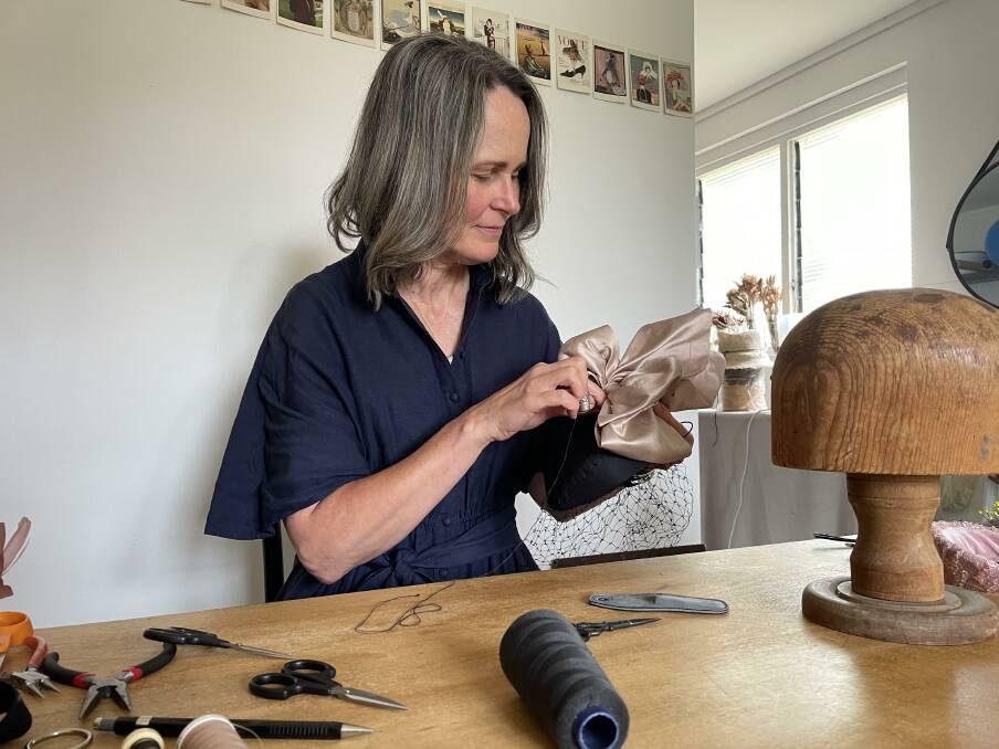 Fiona Schofield, Orange, working on a bespoke headpiece in her workshop. Picture by Karen Bailey.