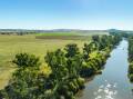A highly productive Macquarie River property with irrigation has sold at auction for a combined $6.99 million. Picture supplied