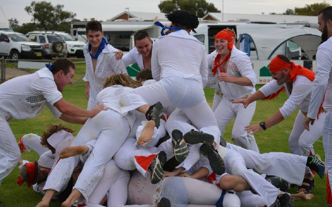Elvis rugby was born in 2015 by the same footy club whose members started the festival-long trend of dressing up as Elvis for the Parkes Elvis Festival. This ruck was captured during their 2017 Elvis rugby match. Picture by Allan Ryan